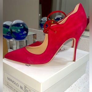 Suede red heel. Has been worn pictures show bottom